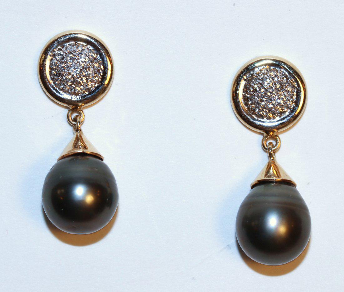 Tahitian Pearl and Diamond14K Yellow Gold Earrings: 14k yellow gold Tahitian pearl and diamond Earrings with pierced ear posts. Earring have a round disc with eighteen pave-set, round brilliant cut diamonds. Dangling is a Tahitian pear black in color w