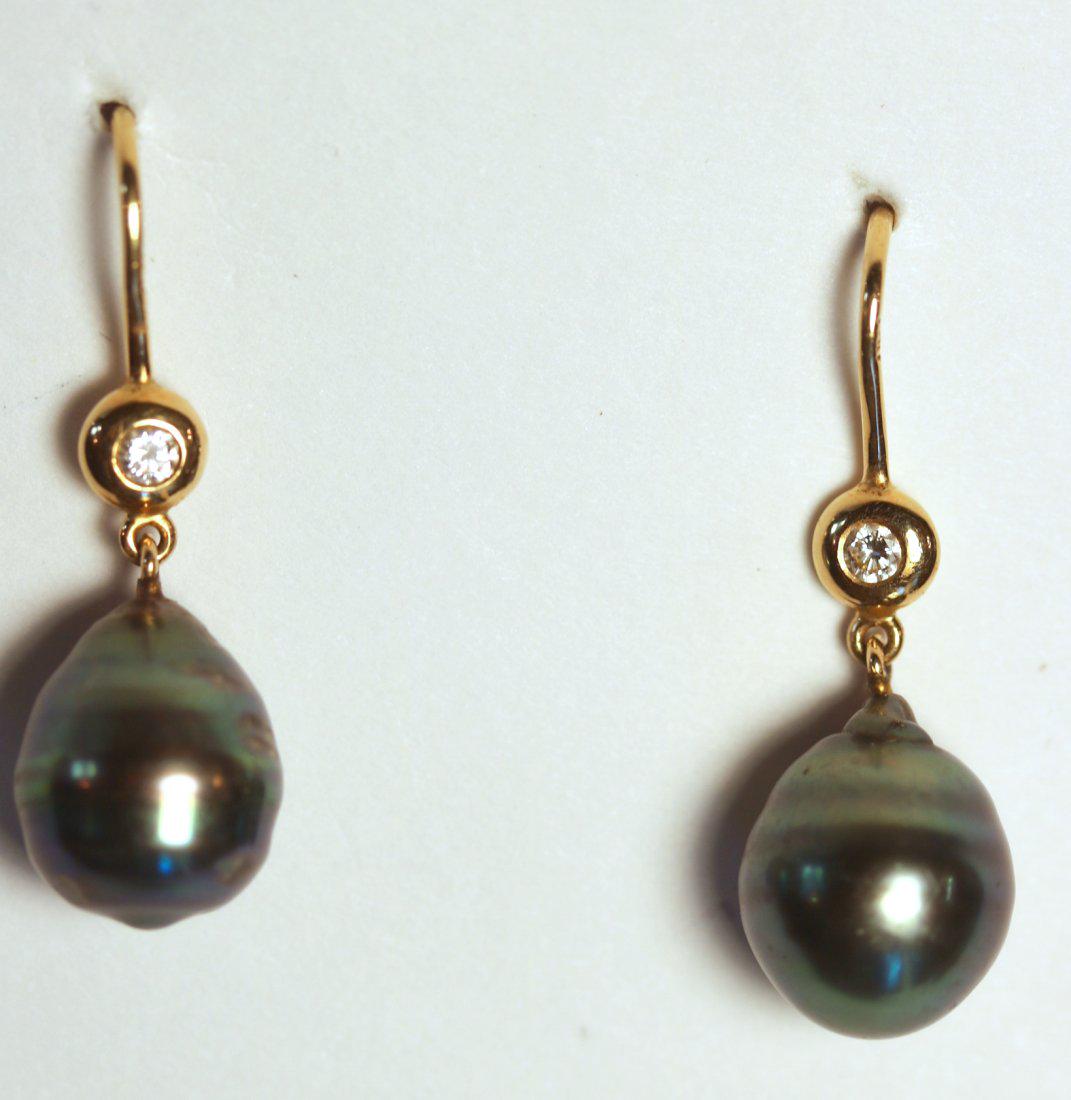 Pearl and Diamond 18K Yellow Gold Earrings: 18k yellow gold earrings with shepherd hook findings. Set at base is a bezel-set, round brilliant cut diamond followed by a Tahitian pearl. Pearls are peacock in color, green overtone with a good lust