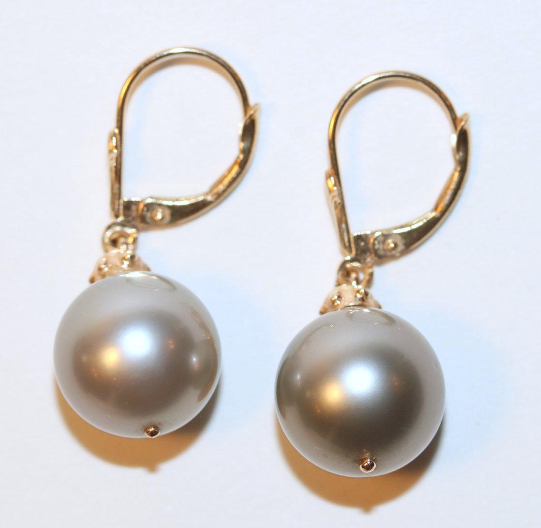 14K Yellow Gold Tahitian Pearl Earrings: 14k yellow gold pierced lever back earrings with dangling Tahitian pearl, silver in color with good luster, round to near round, lightly blemished with good matching. Condition, normal wear. TW and si