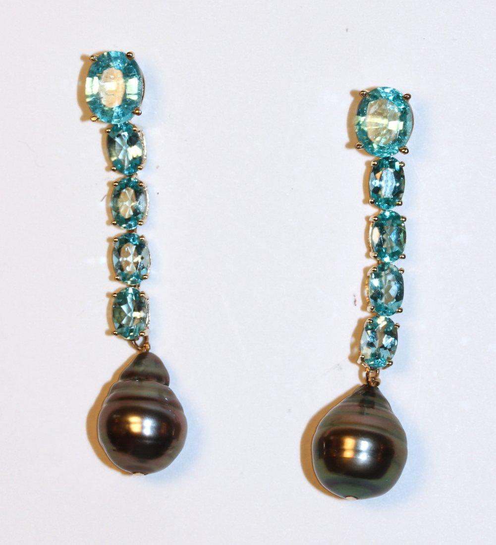 Tourmaline, Blue Topaz and Tahitian Peal 14K Yellow: 14k yellow gold earrings with pierced ear posts. Drop style with an oval cut Tourmaline followed by four blue Topaz and ending with a Tahitian pearl. TW of Colored Stones: 4.38ct TW of Earrings: 7.77g