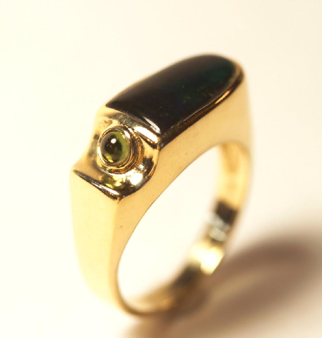 14K Yellow Gold Ammolite & Peridot Ring: 14k yellow gold ammolite and peridot ring. TW of Colored Stones: 0.27ct TW of Ring: 7.48gm Size: 7.75 TW and sizes are Approximate. See accompanying appraisal copy for in-depth description. Appraisal 