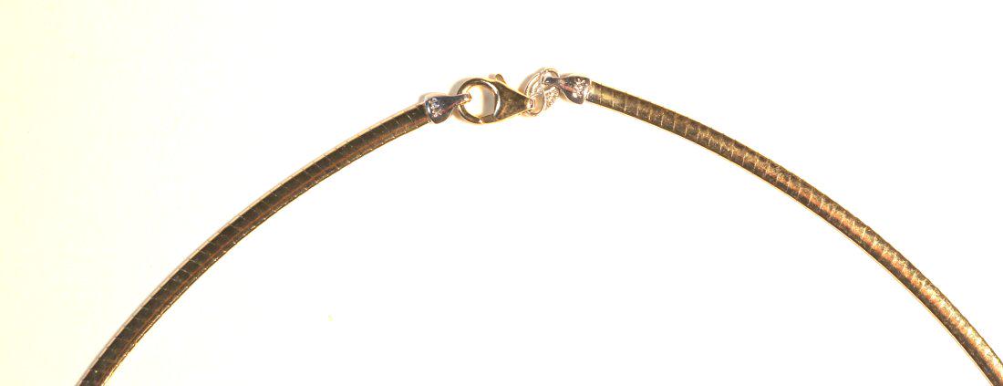 14K Yellow Gold Omega Chain: 14k yellow gold with high polish finish. 2.85mm wide and 18â€ long with lobster clasp. Trademark, Peru, condition good. TW of Chain: 8.06gm TW and sizes are Approximate. See accompanying appraisal 