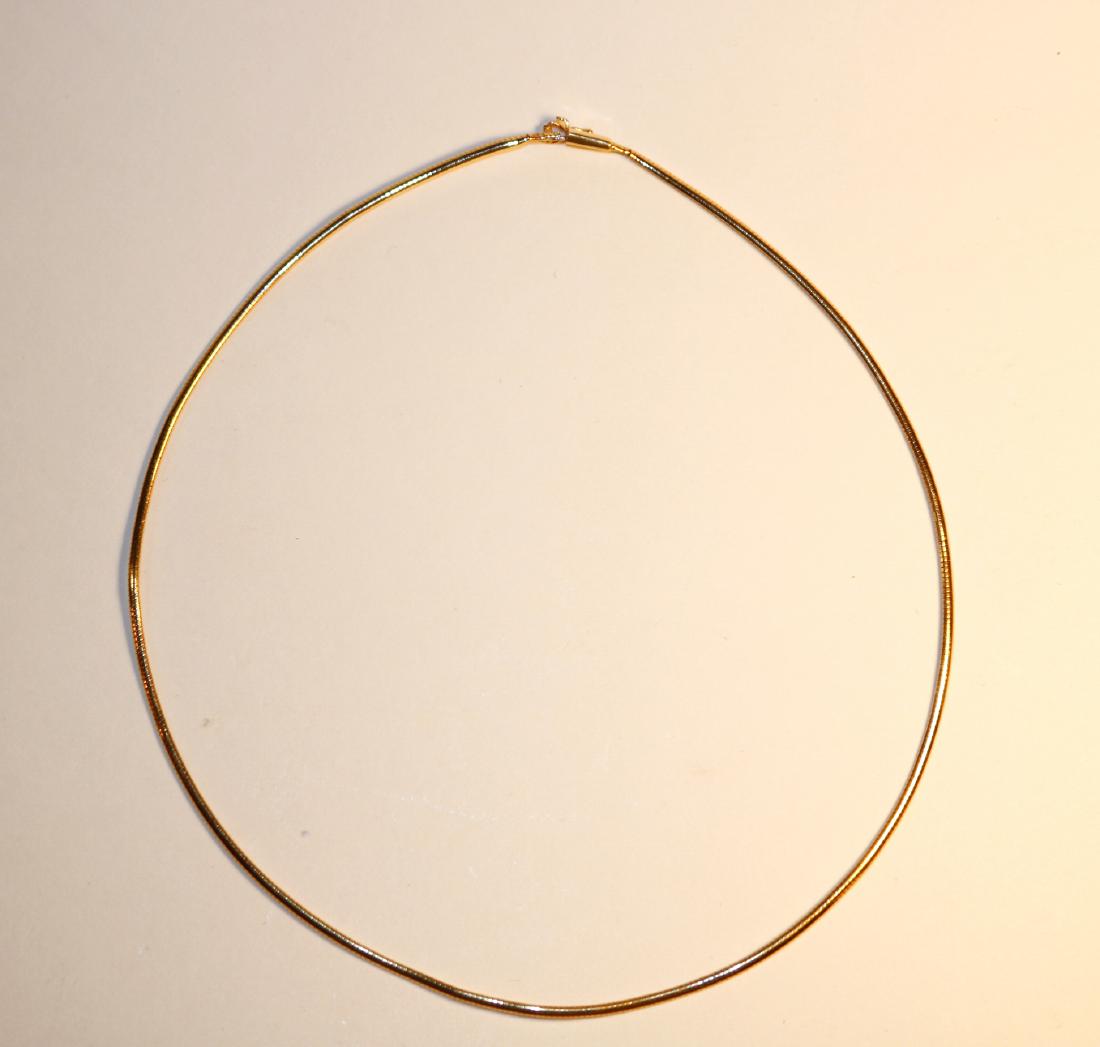 18K Yellow Gold Omega Chain: 18k yellow gold omega chain with high polish finish. 3mm wide and 17.5â€ long with insert clasp and figure eight safety. Trademark, Italy, condition BENT. TW of Chain: 12.03gm TW and sizes are Appr