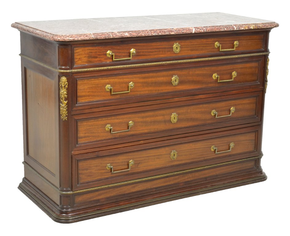 A VICTORIAN STYLE FOUR DRAWER MAHOGANY AND BRONZE ORMOL: A VICTORIAN STYLE FOUR DRAWER MAHOGANY AND BRONZE ORMOLU LION AND LIZARD COMMODE Late 19th - Early 20th Century, Italy An antique Victorian style commode features a salmon and white marble top, a laur