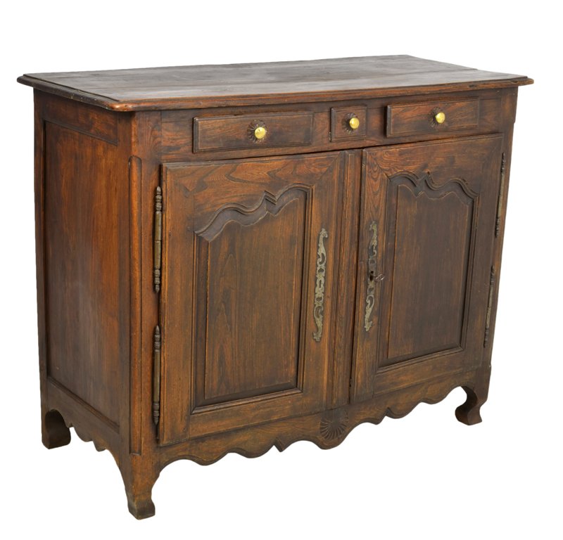 AN ANTIQUE LOUIS XV STYLE OAK BUFFET WITH LONG HINGES: AN ANTIQUE LOUIS XV STYLE OAK BUFFET WITH LONG HINGES Late 19th Century The shaped, bull nose edge top is supported by a recessed, conforming body housing two frieze drawers and faux drawer with brass