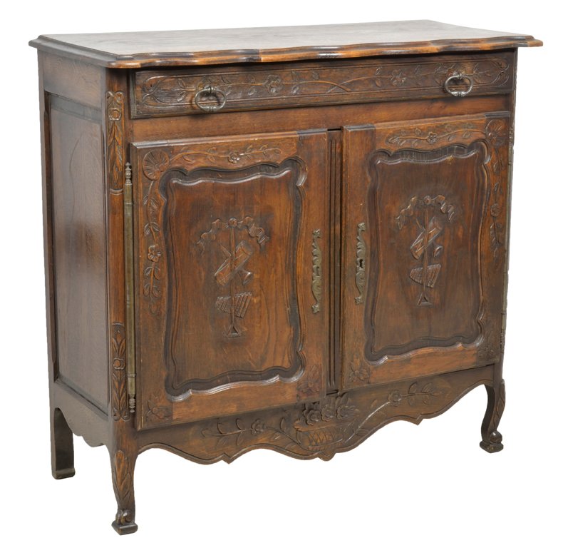AN ANTIQUE LOUIS XV STYLE OAK SIDEBOARDWITH DRUMS AND F: AN ANTIQUE LOUIS XV STYLE OAK SIDEBOARDWITH DRUMS AND FLUTE Early 20th Century An antique Louis XV style oak sideboard having a scalloped top, a single foliate carved drawer, above two carved raised p