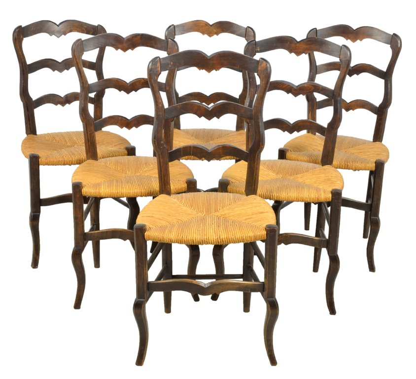 A SET OF SIX LOUIS XV STYLE PROVENCAL OAK CHAIRS WITH R: A SET OF SIX LOUIS XV STYLE PROVENCAL OAK CHAIRS WITH RUSH SEATS Late 19th-Early 20th Century, France A set of six Louis XV style oak chairs features a double arched crest rail, shaped uprights, ladde