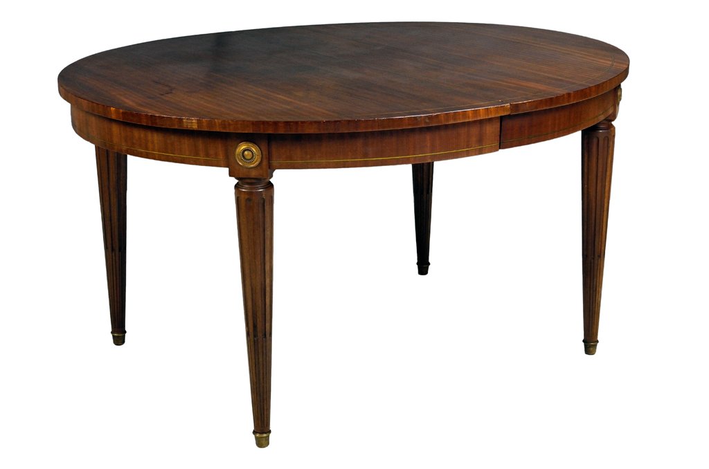 A VINTAGE MID-CENTURY FRENCH EMPIRE STYLE TABLE: A VINTAGE MID-CENTURY FRENCH EMPIRE STYLE TABLE Mid 20th Century, France A vintage Louis XVI style oval table having attractive grain at top, inlaid bronze tracery, with bronze medallion mounts at joi