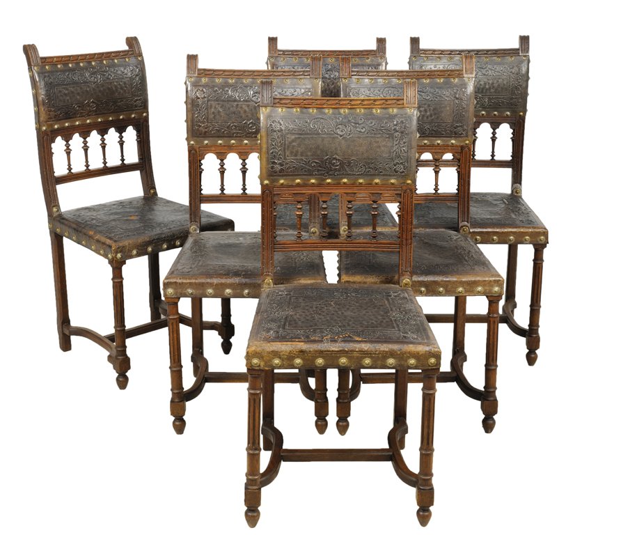 A SET OF SIX HENRI II STYLE CHAIRS WITH ARCADE AND EMBO: A SET OF SIX HENRI II STYLE CHAIRS WITH ARCADE AND EMBOSSED LEATHER COVER Early 20th Century, France A set of six Henri II style chairs are covered with embossed leather at upper back splat, having a 