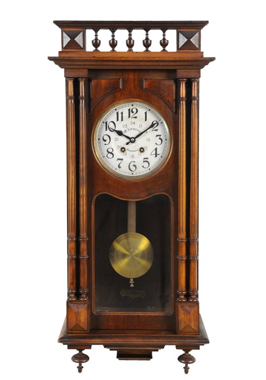 A HENRI II STYLE PENDULUM WALL CLOCK: A HENRI II STYLE PENDULUM WALL CLOCK Early 20th Century A Henri II style hanging wall clock features a finial spindle gallery with flanking columnar uprights on lozenge block detail base, having suspe