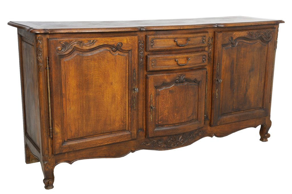A LOUIS XV STYLE ENFILADE BUFFET: A LOUIS XV STYLE ENFILADE BUFFET Late 19th - Early 20th Century A Louis XV style enfilade having a shaped top, two carved foliate panel cabinets below with antique long hinges, and center smaller pane