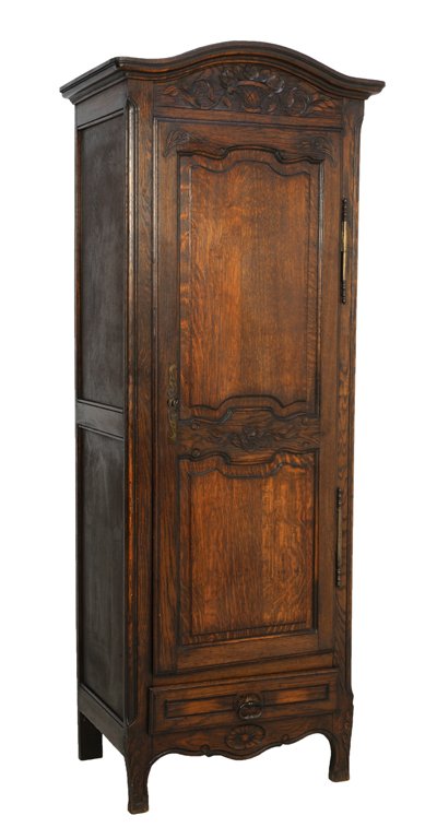 AN ANTIQUE LOUIS XV STYLE SINGLE DOOR ARMOIRE: AN ANTIQUE LOUIS XV STYLE SINGLE DOOR ARMOIRE Late 19th-Early 20th Century An antique Louis XV style armoire features a stepped camel back cornice, a basket and flower carved frieze, a single door wit