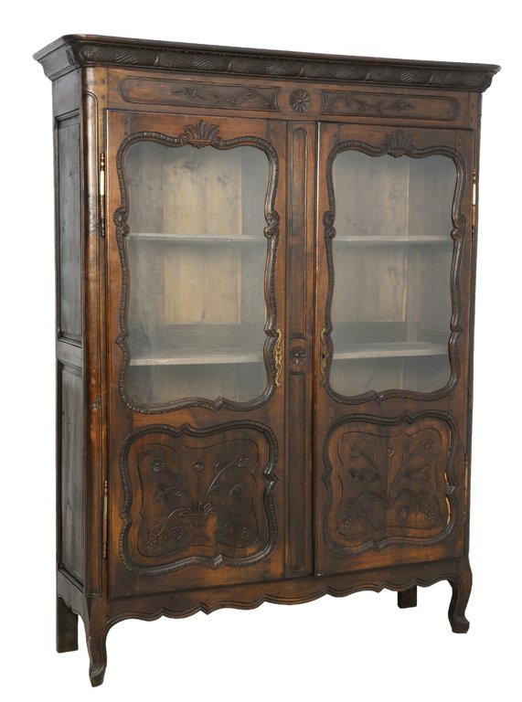 A LOUIS XV STYLE VITRINE DISPLAY CABINET: A LOUIS XV STYLE VITRINE DISPLAY CABINET Late 19th - Early 20th Century A Louis XV style armoire features a stepped cornice, long antique hinges on two glazed panel doors, having a scalloped apron, on