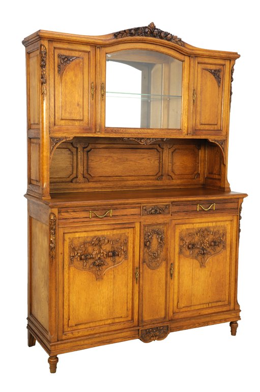 A VICTORIAN STYLE BUD AND FESTOON SIDEBOARD BUFFET: A VICTORIAN STYLE BUD AND FESTOON SIDEBOARD BUFFET Late 19th - Early 20th Century, France A Victorian style sideboard is crowned by a carved bud festoon, having three upper panels, the center is glaze