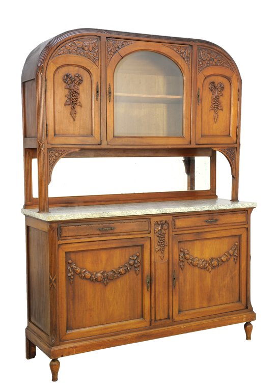 A LOUIS XVI STYLE BUFFET RIBBON, GRAPE, AND BUD FESTOON: A LOUIS XVI STYLE BUFFET RIBBON, GRAPE, AND BUD FESTOON Early - Mid 20th Century A Louis XVI style buffet having a curved crest with heavily carved corner details, three upper cabinets with center gla