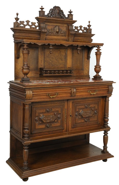 A RENAISSANCE REVIVAL FRENCH VICTORIAN STYLE SIDEBOARD: A RENAISSANCE REVIVAL FRENCH VICTORIAN STYLE SIDEBOARD Early 20th Century A renaissance revival style side board is crowned by an arched pediment with finial flanking details and on a stepped base wit