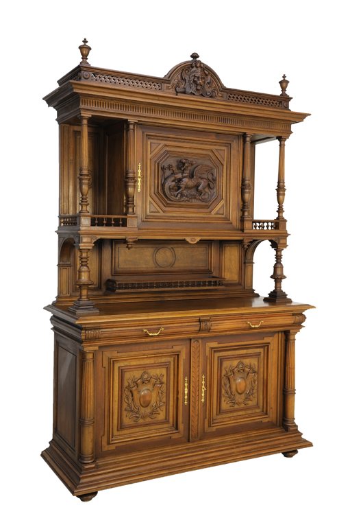 A HENRI II STYLE WALNUT BUFFET WITH ALLIGATOR AND LION : A HENRI II STYLE WALNUT BUFFET WITH ALLIGATOR AND LION HUNT THEME Late 19th - Early 20th Century A Henri II style walnut buffet features an arched carved lion shield with pierced ""F"" scroll gallery 