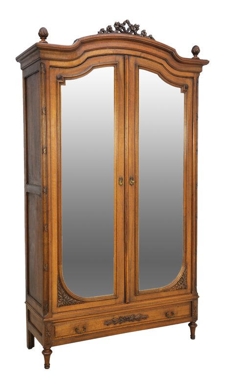 A LOUIS XVI STYLE ARMOIRE: A LOUIS XVI STYLE ARMOIRE 19th Century The stepped, arched cornice features a pair of carved acorn finals surmounting a conforming, recessed body highlighted by carved reeding details at the corners w