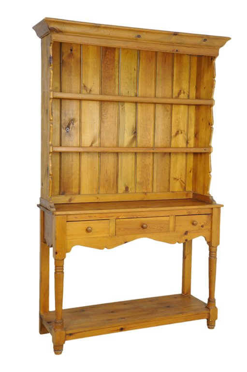 A RUSTIC PINE HUTCH: A RUSTIC PINE HUTCH 20th Century A rustic pine hutch with inverted cornice, having two upper shelves, with a lower portion having three drawers, an open shelf below, is raised on turned and block feet