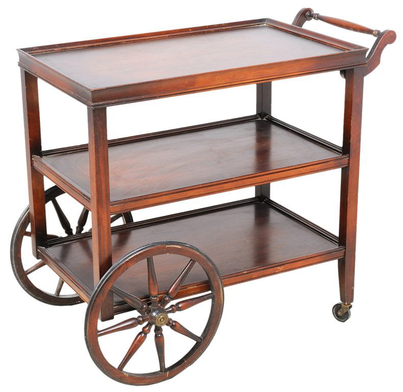 A VINTAGE ROLLING SERVING CART WITH WAGON WHEELS