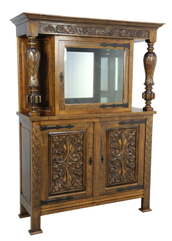 A RENAISSANCE REVIVAL ENGLISH STYLE DISPLAY CABINET CUP: A RENAISSANCE REVIVAL ENGLISH STYLE DISPLAY CABINET CUPBOARD Early 20th Century A Renaissance Revival style cupboard features an inverted stepped cornice, with winding grape carved frieze, having a tr