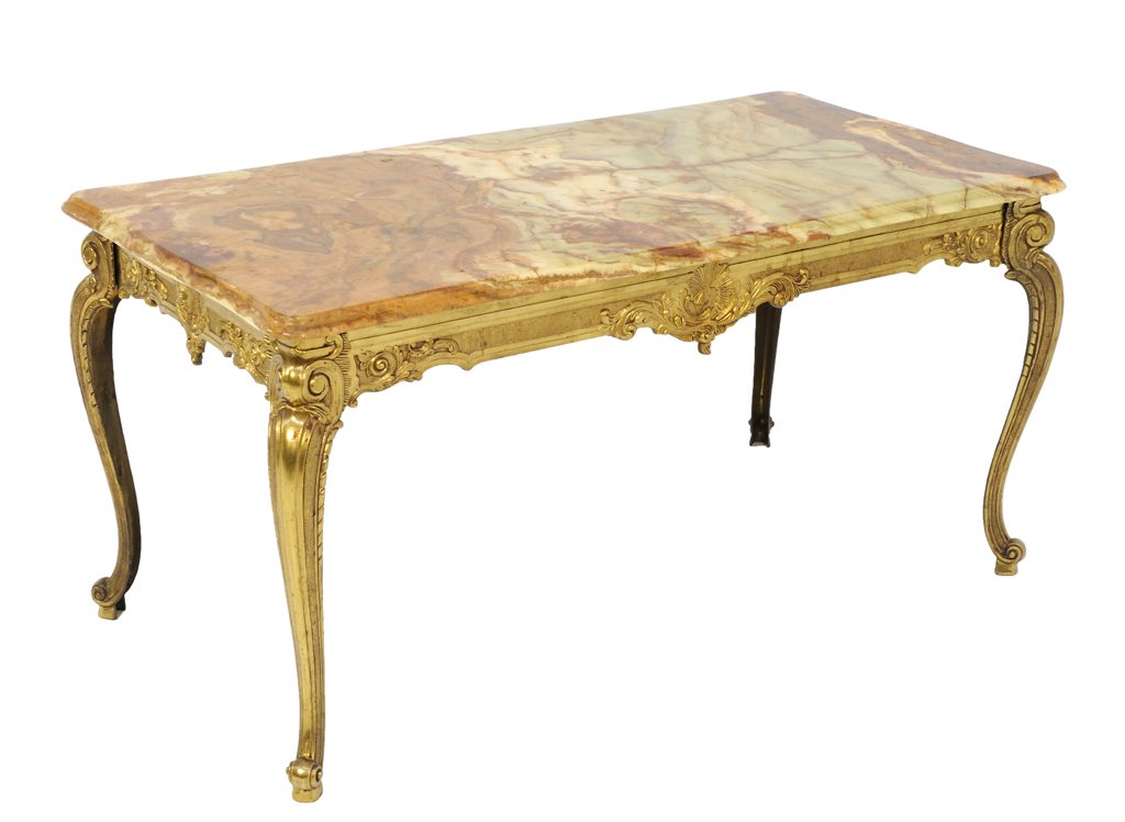 A GILT BRONZE AND MARBLE TOP SOFA TABLE: A GILT BRONZE AND MARBLE TOP SOFA TABLE Early- Mid 20th Century A gilt bronze doré style table base with red marble top, having scrolling foliate details throughout; raised on cabriole legs. In very 
