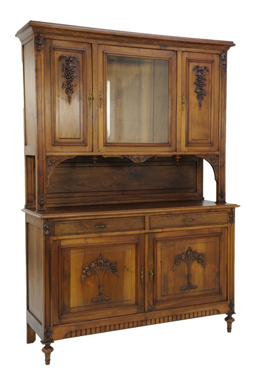 AN ANTIQUE LOUIS XVI STYLE OAK SIDEBOARD WITH GRAPE AND: AN ANTIQUE LOUIS XVI STYLE OAK SIDEBOARD WITH GRAPE AND POMEGRANATE Early 20th Century An antique Louis XVI style sideboard with a three cabinet upper portion with carved grape bunches flanking a glaz