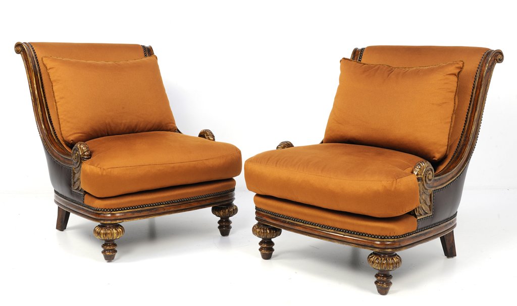 A PAIR OF BOUDOIR LOUNGE CHAIRS: A PAIR OF BOUDOIR LOUNGE CHAIRS 20th Century A pair of boudoir lounge chairs features canted scroll backs, ""T"" seet cushions, a carved and bronze painted fern scroll hand rest, are raised on carved