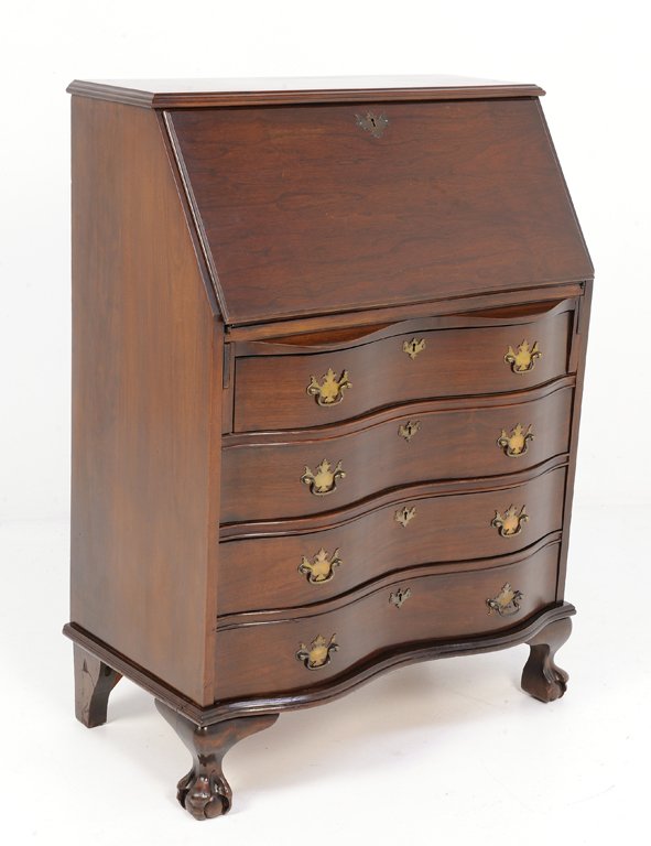A MAHOGANY SERPENTINE FLIP TOP SECRETARY: A MAHOGANY SERPENTINE FLIP TOP SECRETARY 20th Century A mahogany secretary features a flip top, with four serpentine drawers, is raised on claw and ball feet. 40½ x 30½ x 17½ inches