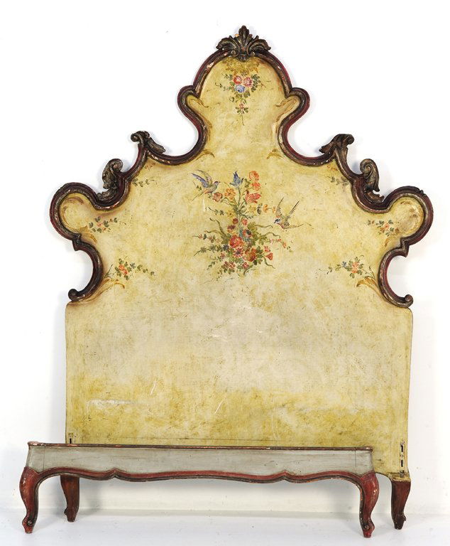 A VENETIAN STYLE PAINTED TWIN BED WITH BUDS: A VENETIAN STYLE PAINTED TWIN BED WITH BUDS 20th Century The shaped crest rail with carved details and painted red border encloses a painted and antiqued headboard featuring painted floral bouquets wi
