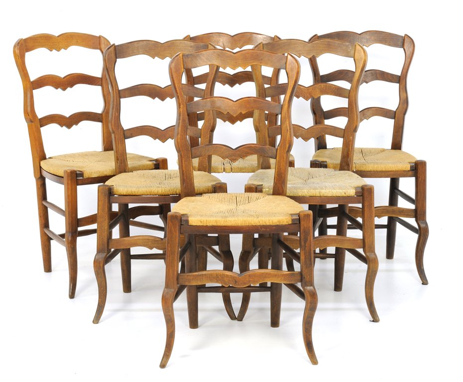 A SET OF SIX LOUIS XV STYLE CHAIRS WITH RUSH SEATS: A SET OF SIX LOUIS XV STYLE CHAIRS WITH RUSH SEATS Late 19th - Early 20th Century A set of six Louis XV style chairs features a double arched crest rail, ladder back, woven rush seats, a floating apro