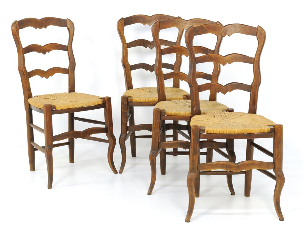 A SET OF FOUR LOUIS XV STYLE CHAIRS WITH RUSH SEATS: A SET OF FOUR LOUIS XV STYLE CHAIRS WITH RUSH SEATS Late 19th - Early 20th Century A set of four Louis XV style chairs features a double arched crest rail, ladder back, woven rush seats, a floating ap