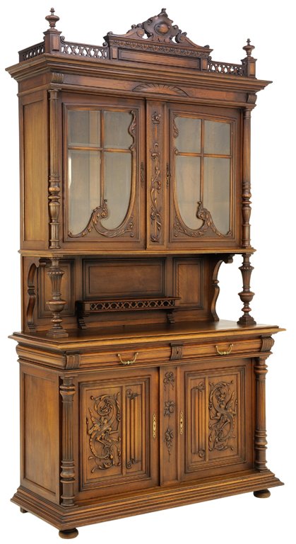 A FRENCH VICTORIAN STYLE WALNUT BUFFET WITH CARVED DRAG: A FRENCH VICTORIAN STYLE WALNUT BUFFET WITH CARVED DRAGON Early 20th Century A French Victorian style walnut buffet features a pierced gallery with shield and cabochon medallion cornice, having glazed