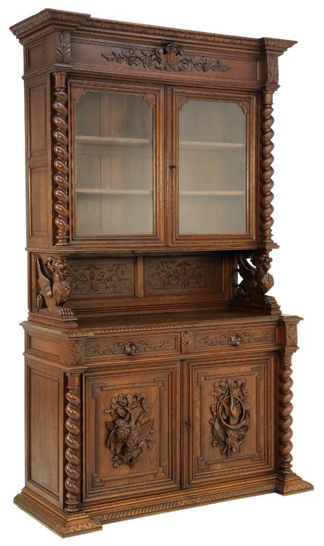 A HENRI II STYLE BUFFET WITH PHEASANT AND HARE HUNT THE: A HENRI II STYLE BUFFET WITH PHEASANT AND HARE HUNT THEME Early 20th Century A Henri II style buffet with a hunt theme features a festoon carved frieze, double upper glazed doors flanked by barley twi