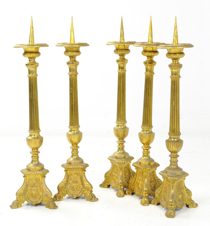 A SET OF FIVE GILT FINISH ALTAR CANDLE STICKS WITH FLAM: A SET OF FIVE GILT FINISH ALTAR CANDLE STICKS WITH FLAMING HEART 20th Century Each reeded altar stick features an ornately cast base in gilt finish. Very good condition. 23½ x 6 x 6 inches Five piece