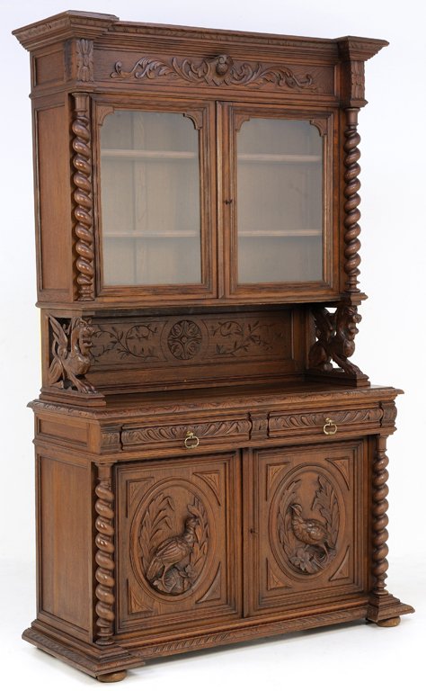 A HENRI II SIDEBOARD WITH GRIFFIN, WATERFOWL AND BARLEY: A HENRI II SIDEBOARD WITH GRIFFIN, WATERFOWL AND BARLEY TWIST Early 20th Century The upper body in walnut finish features a locking cabinet with glass doors which open to reveal interior shelving flan