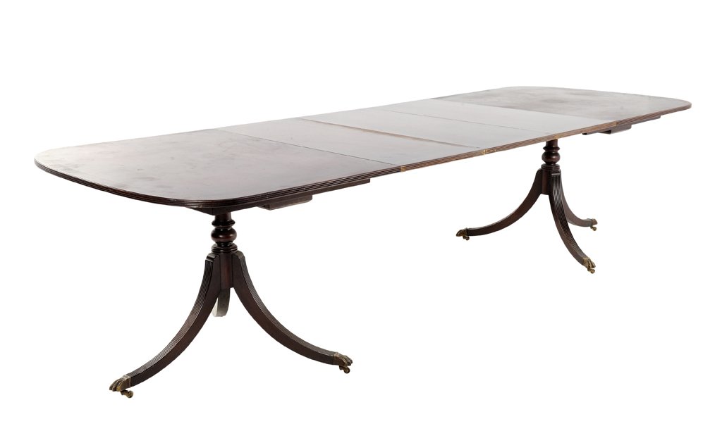 A DUNCAN PHYFE STYLE PEDESTAL TABLE WITH THREE LEAVES: A DUNCAN PHYFE STYLE PEDESTAL TABLE WITH THREE LEAVES 20th Century A pedestal table includes three leaves features a carved reed edge, is raised on two turned uprights on tripartite splayed feet and c