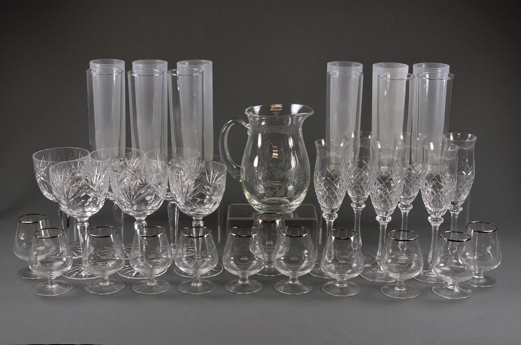 A GROUP OF BREAKFAST BARWARE: A GROUP OF BREAKFAST BARWARE 20th Century A collection of entertainment barware and glassware includes twelve tall glasses (six frosted, six clear) twelve dessert glasses with silver rim, six cut wine