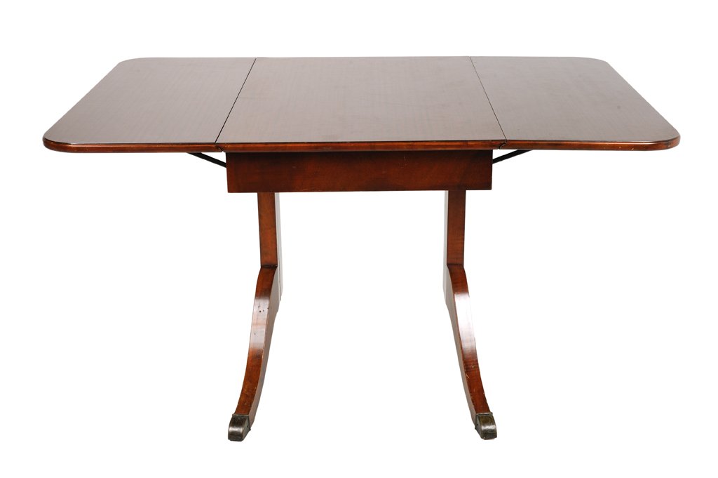 A VINTAGE "EXTENSOLE" MAHOGANY DROP LEAF TABLE: A VINTAGE ""EXTENSOLE"" MAHOGANY DROP LEAF TABLE USA, Mid 20th Century A vintage EXTENSOLE mahogany drop leaf table features interior storage and covered feet. Extensole Corp., Sparta, Michigan (1936-