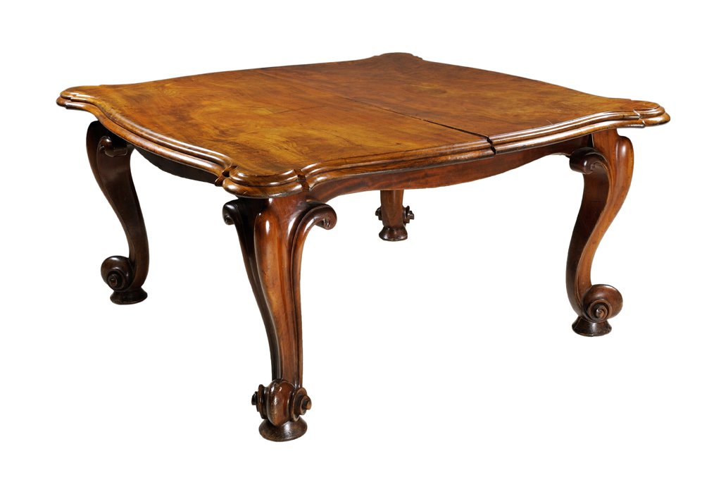 A GRAND LOUIS XV STYLE CHERRY DINING TABLE Third: A GRAND LOUIS XV STYLE CHERRY DINING TABLE Third Quarter 19th Century The solid plank top table with expressed corners is supported by four bold scroll form legs raised on pad feet. When opened and th
