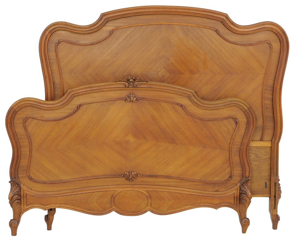 A DIAMOND PARQUETRY LOUIS XV STYLE BED IN A WALNUT: A DIAMOND PARQUETRY LOUIS XV STYLE BED IN A WALNUT FINISH Early 20th Century A diamond parquetry Louis XV style bed with camelback crest features a carved acanthus leaf detail at center, and on cabrio
