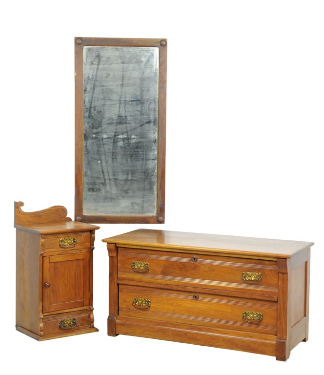 A TURN OF THE CENTURY VICTORIAN THREE PIECE VANITY SET: A TURN OF THE CENTURY VICTORIAN THREE PIECE VANITY SET Early 20th Century A three piece vanity set includes a mirror with roundel details, a small cabinet, and a single two door chest. Wear commensura