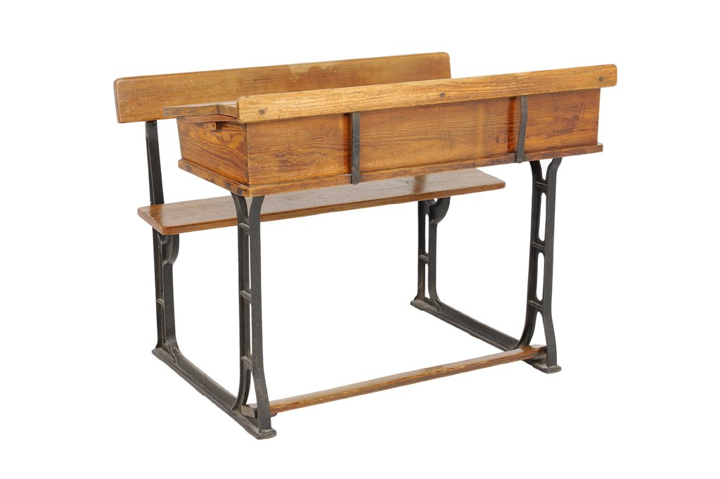 AN ANTIQUE DOUBLE SEAT OAK SCHOOL DESK WITH BENCH: AN ANTIQUE DOUBLE SEAT OAK SCHOOL DESK WITH BENCH Early 20th Century An antique double seat oak school desk with flip top, an ""H"" style foot rest and a bench seat. Wear detected. Overall in very goo