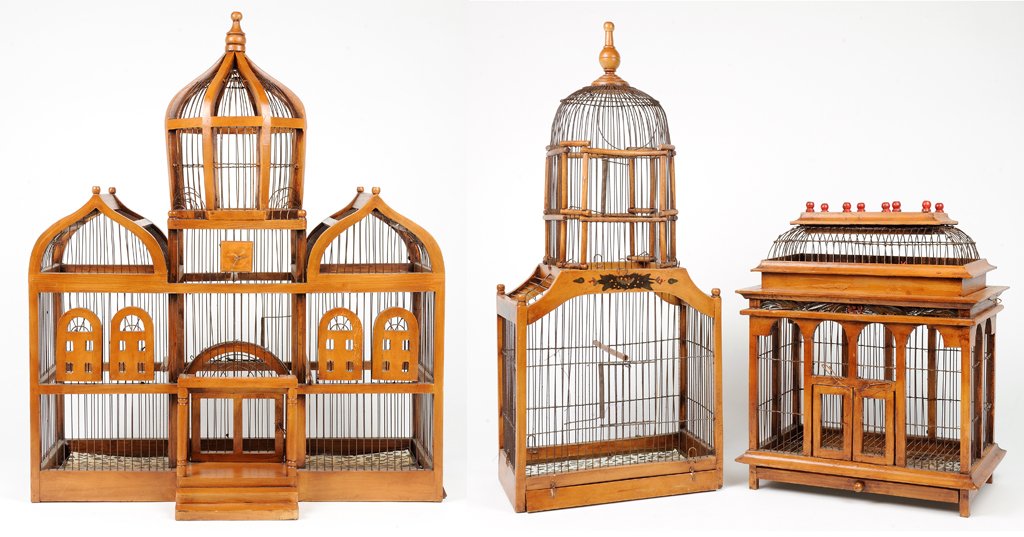 A TRIO OF VINTAGE INDONESIAN BIRD CAGES: A TRIO OF VINTAGE INDONESIAN BIRD CAGES Mid-Late 20th Century Three antique bird cages include a rectilinear form, a single dome form and an onion dome form bird cage. All in very good condition, wear