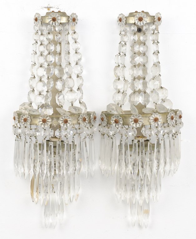 A PAIR OF EMPIRE STYLE ENCRUSTED CRYSTAL ONE LIGHT: A PAIR OF EMPIRE STYLE ENCRUSTED CRYSTAL ONE LIGHT SCONCES 20th Century A pair of Empire style encrusted crystal one light sconces having octagon, floret and icicle crystals. In very good condition, w