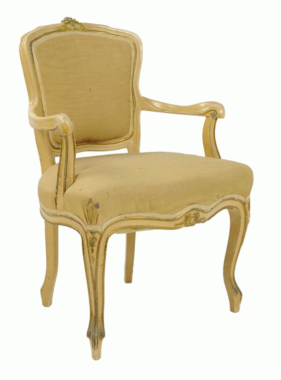 A LOUIS XV STYLE PAINTED ARMCHAIR WITH FLORAL DETAILS: A LOUIS XV STYLE PAINTED ARMCHAIR WITH FLORAL DETAILS 20th Century Of typical form, this chair features a painted frame highlighted by floral accents at the crest rail, corners and apron enclosing an