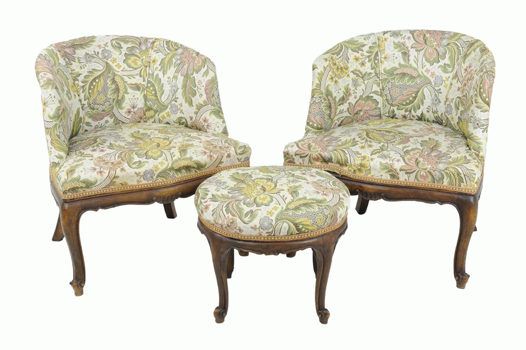 A PAIR OF PETITE CRÈME AND FERN LOUIS XV STYLE BEDROOM: A PAIR OF PETITE CRÈME AND FERN LOUIS XV STYLE BEDROOM CHAIRS AND A STOOL Late 19th - Early 20th Century A pair of petite crème and fern colored brocade covered wingback club salon chairs feature a 