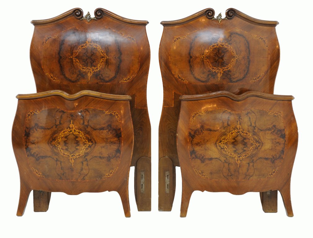 A PAIR OF ITALIAN ROCOCO STYLE MARQUETRY INLAID BOMBÉ: A PAIR OF ITALIAN ROCOCO STYLE MARQUETRY INLAID BOMBÉ BEDS Early 20th Century Each twin bed featuring a scrolling crest rail surmounting a bombe front highlighted by inlaid marquetry and burled wood;