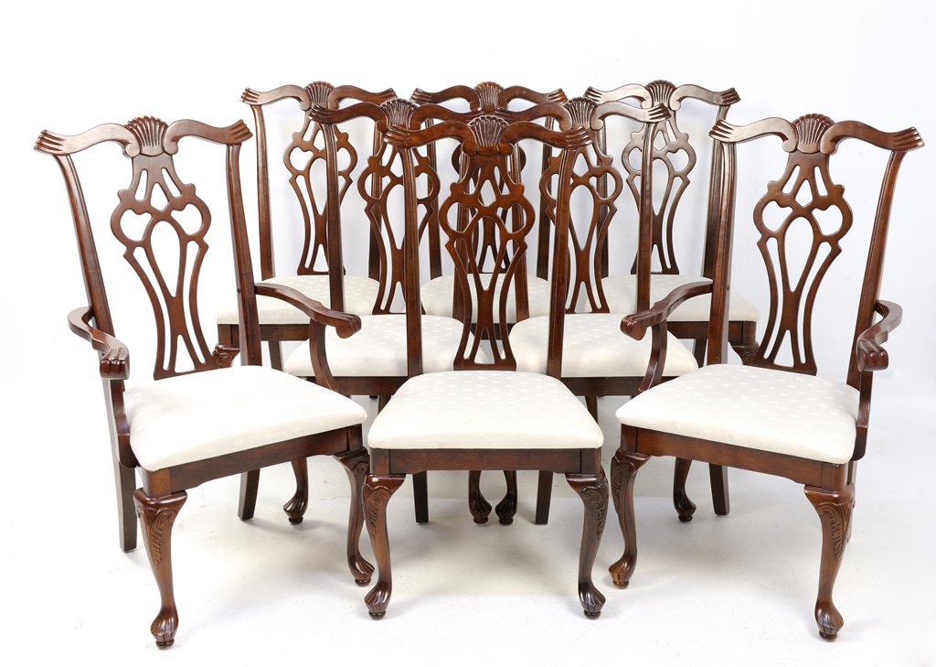 A SET OF EIGHT GOTHIC CHIPPENDALE STYLE CHAIRS: A SET OF EIGHT GOTHIC CHIPPENDALE STYLE CHAIRS 20th Century A set of eight Chippendale style chairs includes two arm chairs and six side chairs with shell motif design, having pierced fiddle backs, wi