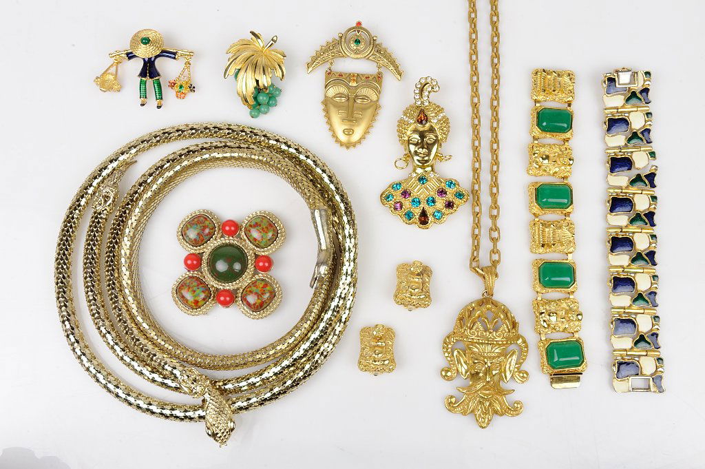 A GROUP OF VINTAGE DESIGNER COSTUME JEWELRY INCLUDES: A GROUP OF VINTAGE DESIGNER COSTUME JEWELRY INCLUDES LUCIEN PICCARD, B & W, AND MORE The group features ""Boucher"", ""Sarahcov"", ""B&W"", ""DG"", ""Whitney & Dovis"" and ""Lucien piccard"" runway pi